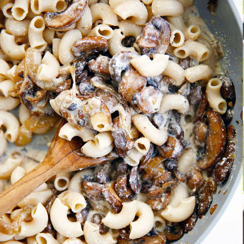 Ricotta Mushroom Strozzapreti served in a shallow bowl with fresh herbs